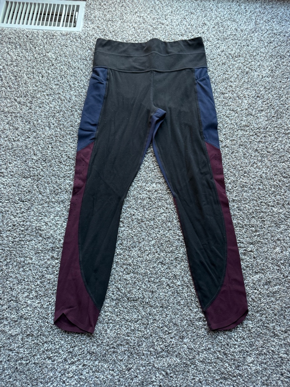 Athleta black leggings with purple and dark blue color blocking, size M